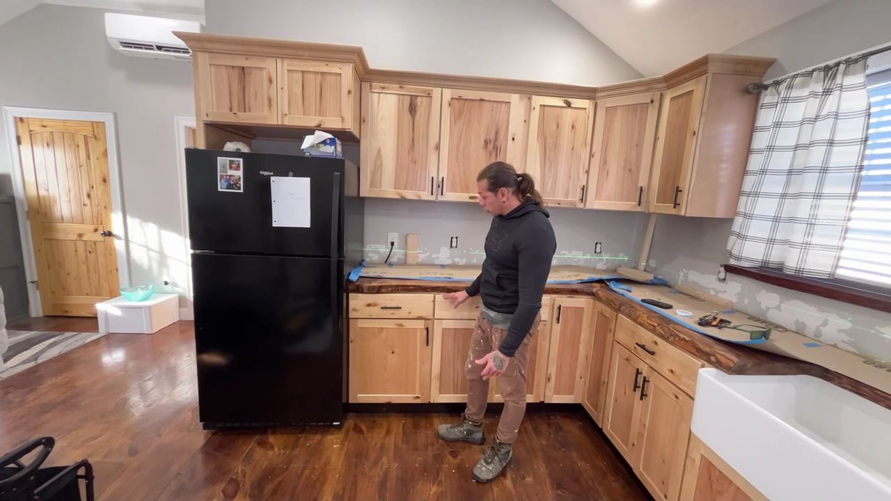 Completed kitchen remodel with new cabinets and farmhouse sink